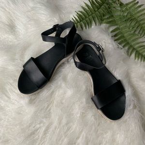 Black ankle strap sandals with white sole